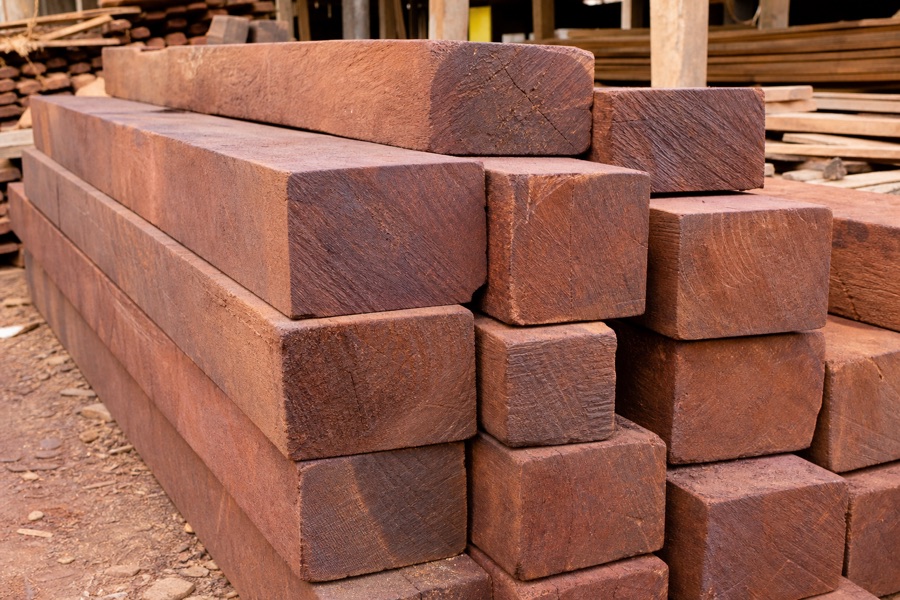 Sal wood beams stacked in a timber yard